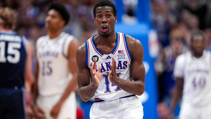 Jan 31, 2026; Lawrence, Kansas, USA; Kansas Jayhawks guard Melvin Council Jr. (14) reacts after a foul call during the second half against the BYU Cougars at Allen Fieldhouse. Mandatory Credit: Jay Biggerstaff-Imagn Images