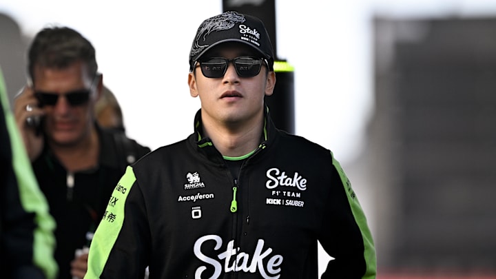 Oct 20, 2024; Austin, Texas, USA; Stake F1 Team Kick Sauber driver Zhou Guanyu (24) of Team China walks through the track entrance before the 2024 Formula One US Grand Prix at Circuit of the Americas. Mandatory Credit: Jerome Miron-Imagn Images