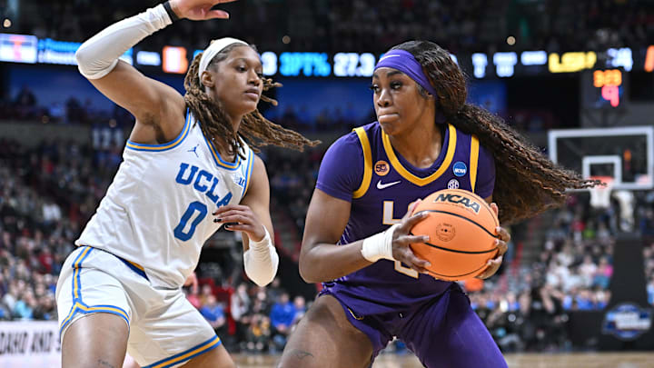 Mar 30, 2025; Spokane, WA, USA; LSU Lady Tigers forward Aneesah Morrow (24) runs the baseline against UCLA Bruins forward Janiah Barker (0) during the second half of a Elite 8 NCAA Tournament basketball game at Spokane Arena. Mandatory Credit: James Snook-Imagn Images