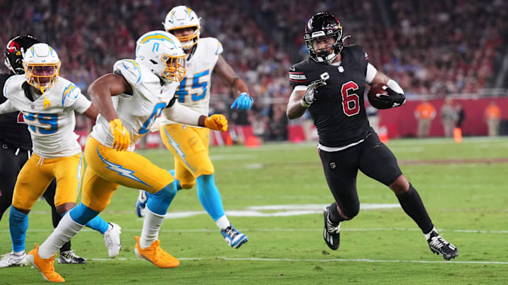 Oct 21, 2024; Glendale, Arizona, USA; Arizona Cardinals running back James Conner (6) runs against the Los Angeles Chargers during the first half at State Farm Stadium. Mandatory Credit: Joe Camporeale-Imagn Images