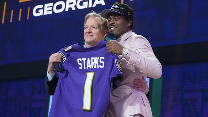 Apr 24, 2025; Green Bay, WI, USA; NFL commissioner Roger Goodell with Georgia Bulldogs safety Malaki Starks after he is selected by the Baltimore Ravens as the number 27 pick in the first round of the 2025 NFL Draft at Lambeau Field. Mandatory Credit: Kirby Lee-Imagn Images