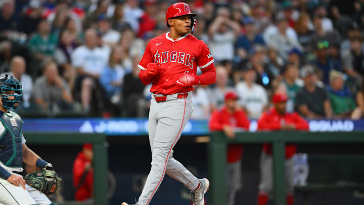 Sep 13, 2025; Seattle, Washington, USA; Los Angeles Angels second baseman Christian Moore (4) scores a run against the Seattle Mariners during the second inning at T-Mobile Park. Mandatory Credit: Steven Bisig-Imagn Images