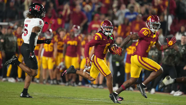 Oct 25, 2024; Los Angeles, California, USA; Southern California Trojans wide receiver Makai Lemon (6) carries the ball on a 70-yard reception against the Rutgers Scarlet Knights in the second half at United Airlines Field at Los Angeles Memorial Coliseum. Mandatory Credit: Kirby Lee-Imagn Images