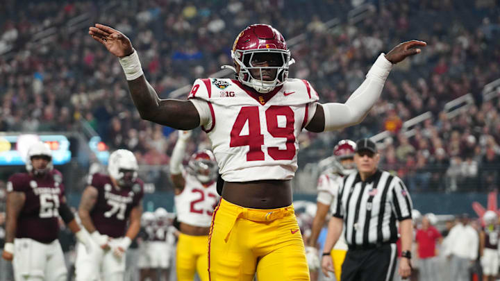 Dec 27, 2024; Las Vegas, NV, USA; Southern California Trojans defensive end Kameryn Fountain (49) celebrates against the Texas A&M Aggies in the first half at Allegiant Stadium. Mandatory Credit: Kirby Lee-Imagn Images