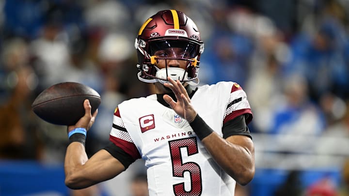 Jan 18, 2025; Detroit, Michigan, USA; Washington Commanders quarterback Jayden Daniels (5) warms up prior to the game against Detroit Lions in a 2025 NFC divisional round game at Ford Field. Mandatory Credit: Lon Horwedel-Imagn Images