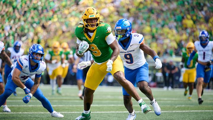 Sep 5, 2026; Eugene, Oregon, USA; Oregon Ducks tight end Jamari Johnson (9) catches a pass for a touchdown during the first half against Boise State Broncos safety Derek Ganter Jr. (9) at Autzen Stadium. Mandatory Credit: Troy Wayrynen-Imagn Images