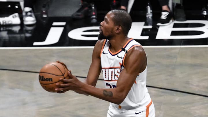 Jan 22, 2025; Brooklyn, New York, USA; Phoenix Suns forward Kevin Durant (35) shoots the ball against the Brooklyn Nets during the first half at Barclays Center. Mandatory Credit: John Jones-Imagn Images