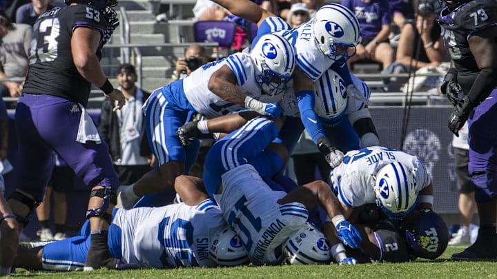 Oct 14, 2023; Fort Worth, Texas, USA; TCU Horned Frogs running back Trey Sanders (2) is gang tackled by the Brigham Young Cougars defense during the game at Amon G. Carter Stadium. Mandatory Credit: Jerome Miron-Imagn Images