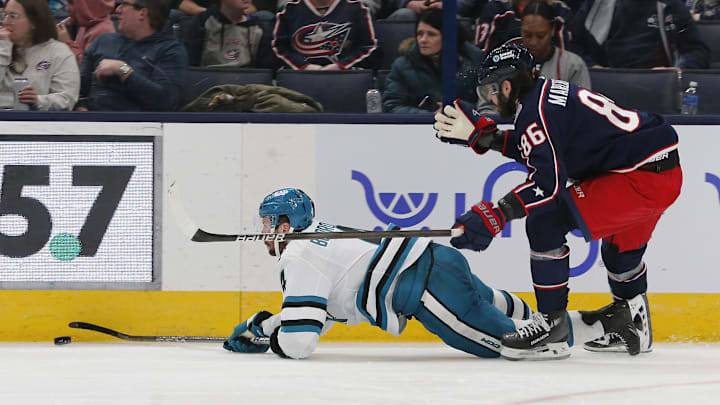 Mar 16, 2024; Columbus, Ohio, USA; San Jose Sharks defenseman Kyle Burroughs (4) falls to the ice