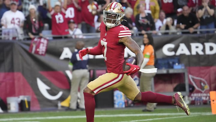 San Francisco 49ers cornerback Charvarius Ward (7) returns an interception for a touchdown against the Arizona Cardinals during the first quarter at State Farm Stadium in Glendale on Dec. 17, 2023. San Francisco 49ers cornerback Charvarius Ward (7) returns an interception for a touchdown against the Arizona Cardinals during the first quarter at State Farm Stadium in Glendale on Dec. 17, 2023.