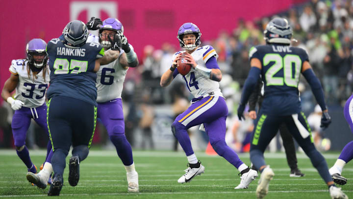 Dec 22, 2024; Seattle, Washington, USA; Minnesota Vikings quarterback Sam Darnold (14) looks to pass the ball during the first half against the Seattle Seahawks at Lumen Field. Dec 22, 2024; Seattle, Washington, USA; Minnesota Vikings quarterback Sam Darnold (14) looks to pass the ball during the first half against the Seattle Seahawks at Lumen Field.