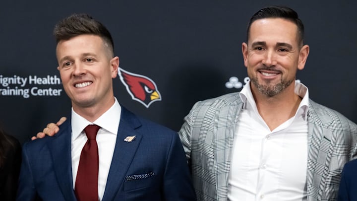 Feb 3, 2026; Tempe, AZ, USA; Arizona Cardinals head coach Mike LaFleur (left) and brother and Green Bay Packers head coach Matt LaFleur at an introductory press conference at the Cardinals training facility. Mandatory Credit: Mark J. Rebilas-Imagn Images