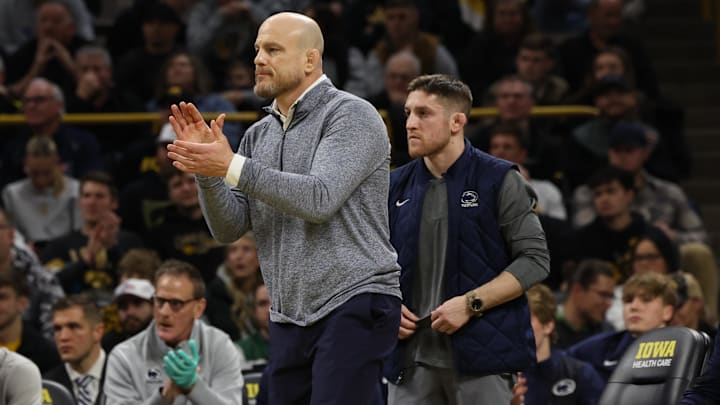 Penn State Nittany Lions head coach Cael Sanderson watches his team wrestle the Iowa Hawkeyes at Carver-Hawkeye Arena.