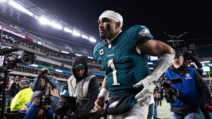 Philadelphia Eagles quarterback Jalen Hurts walks off the field after a win against the Pittsburgh Steelers.