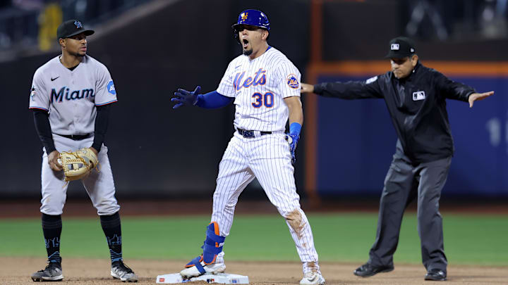 Sep 28, 2023; New York City, New York, USA; New York Mets center fielder Rafael Ortega (30) reacts after hitting an RBI double against the Miami Marlins during the eighth inning at Citi Field. Mandatory Credit: Brad Penner-Imagn Images