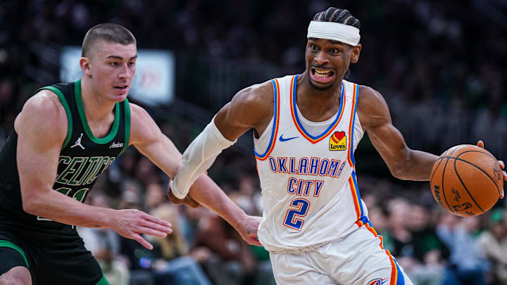 Mar 12, 2025; Boston, Massachusetts, USA; Oklahoma City Thunder guard Shai Gilgeous-Alexander (2) drives the ball against Boston Celtics guard Payton Pritchard (11) in the third quarter at TD Garden. Mandatory Credit: David Butler II-Imagn Images