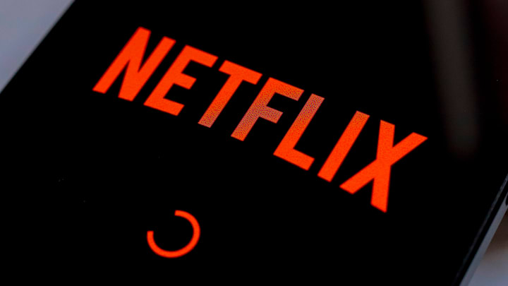 In this photo illustration, the Netflix streaming app logo...