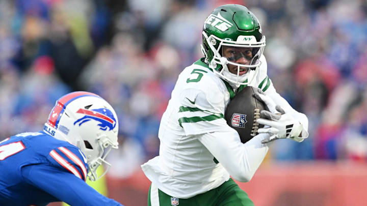 Dec 29, 2024; Orchard Park, New York, USA; New York Jets wide receiver Garrett Wilson (5) tries to get past Buffalo Bills safety Cole Bishop (24) after making a catch in the second quarter at Highmark Stadium. Mandatory Credit: Mark Konezny-Imagn Images Dec 29, 2024; Orchard Park, New York, USA; New York Jets wide receiver Garrett Wilson (5) tries to get past Buffalo Bills safety Cole Bishop (24) after making a catch in the second quarter at Highmark Stadium. Mandatory Credit: Mark Konezny-Imagn Images