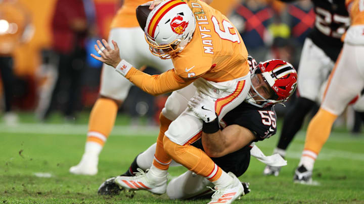 Dec 11, 2025; Tampa, Florida, USA; Atlanta Falcons linebacker Kaden Elliss (55) sacks Tampa Bay Buccaneers quarterback Baker Mayfield (6) during the first quarter at Raymond James Stadium. Mandatory Credit: Nathan Ray Seebeck-Imagn Images