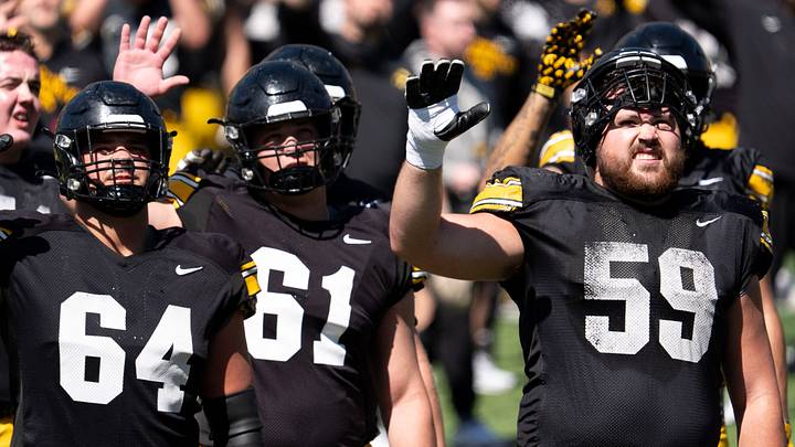 Iowa offensive linemen Leighton Jones (64), Cael Winter (61), and Trevor Lauck (59) wave to patients of the Stead Family Children’s Hospital April 25, 2026 during the team’s spring practice at Kinnick Stadium in Iowa City, Iowa.