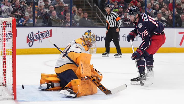 Blue Jackets center Adam Fantilli scores on Predators goaltender Juuse Saros. 