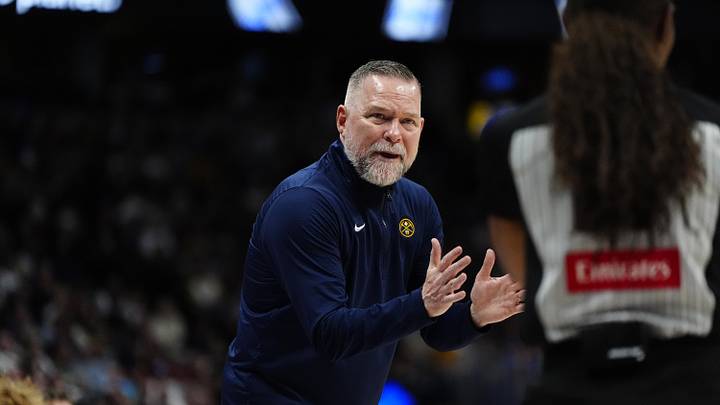 Apr 6, 2025; Denver, Colorado, USA; Denver Nuggets head coach Michael Malone reacts towards referee Danielle Scott (87) in the second half against the Indiana Pacers at Ball Arena. Mandatory Credit: Ron Chenoy-Imagn Images