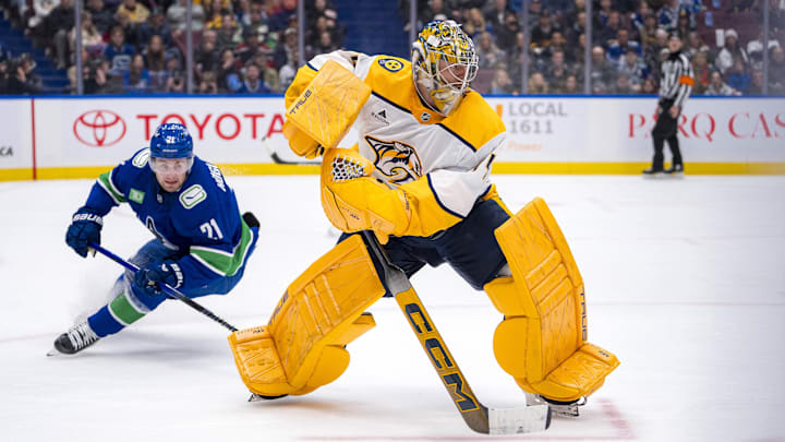 Jan 3, 2025; Vancouver, British Columbia, CAN; Vancouver Canucks forward Nils Hoglander (21) watches Nashville Predators goalie Juuse Saros (74) handle the puck in the second period at Rogers Arena. Mandatory Credit: Bob Frid-Imagn Images Jan 3, 2025; Vancouver, British Columbia, CAN; Vancouver Canucks forward Nils Hoglander (21) watches Nashville Predators goalie Juuse Saros (74) handle the puck in the second period at Rogers Arena. Mandatory Credit: Bob Frid-Imagn Images
