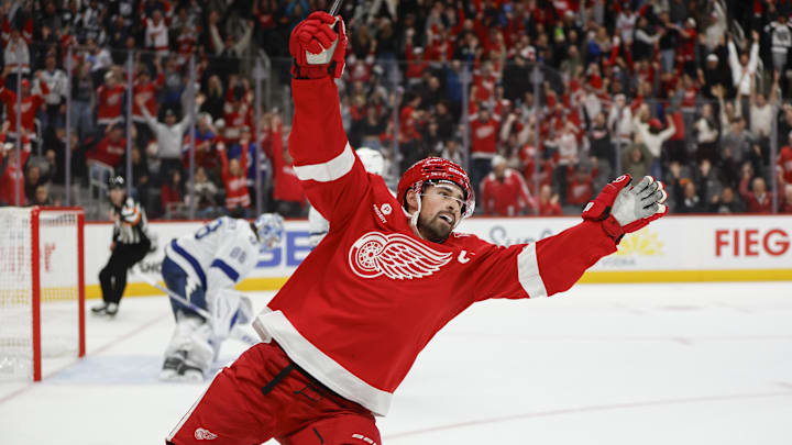 Oct 17, 2025; Detroit, Michigan, USA; Detroit Red Wings center Dylan Larkin (71) scores the game winning goal in overtime against Tampa Bay Lightning goaltender Andrei Vasilevskiy (88) at Little Caesars Arena. Mandatory Credit: Brian Bradshaw Sevald-Imagn Images