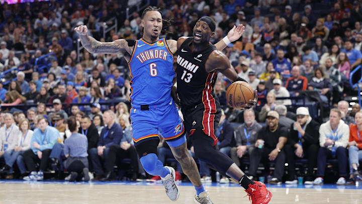 Feb 12, 2025; Oklahoma City, Oklahoma, USA;Miami Heat center Bam Adebayo (13) drives to the basket beside Oklahoma City Thunder forward Jaylin Williams (6) during the second quarter at Paycom Center. Mandatory Credit: Alonzo Adams-Imagn Images Feb 12, 2025; Oklahoma City, Oklahoma, USA;Miami Heat center Bam Adebayo (13) drives to the basket beside Oklahoma City Thunder forward Jaylin Williams (6) during the second quarter at Paycom Center. Mandatory Credit: Alonzo Adams-Imagn Images