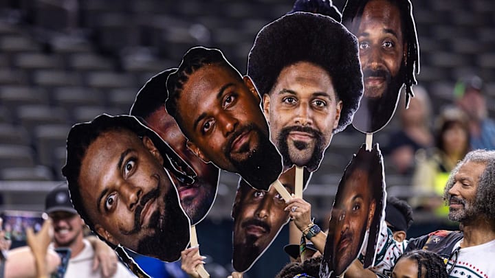 Dec 21, 2025; New Orleans, Louisiana, USA;  New Orleans Saints defensive end Cameron Jordan (94) poses for pictures with his family during warm ups before the game against the New York Jets at Caesars Superdome. Mandatory Credit: Stephen Lew-Imagn Images