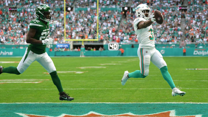 Raheem Mostert scores a touchdown past New York Jets safety Tony Adams during the first half of a game at Hard Rock Stadium last season. Raheem Mostert scores a touchdown past New York Jets safety Tony Adams during the first half of a game at Hard Rock Stadium last season.