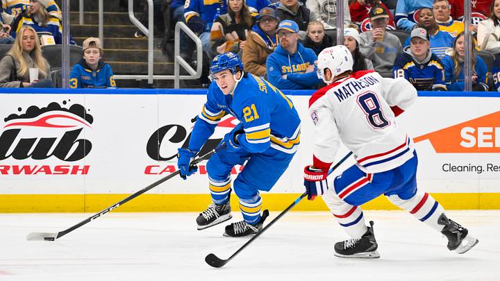 Jan 3, 2026; St. Louis, Missouri, USA; St. Louis Blues right wing Jimmy Snuggerud (21) controls the puck as Montreal Canadiens defenseman Mike Matheson (8) defends during the second period at Enterprise Center. Mandatory Credit: Jeff Curry-Imagn Images Jan 3, 2026; St. Louis, Missouri, USA; St. Louis Blues right wing Jimmy Snuggerud (21) controls the puck as Montreal Canadiens defenseman Mike Matheson (8) defends during the second period at Enterprise Center. Mandatory Credit: Jeff Curry-Imagn Images