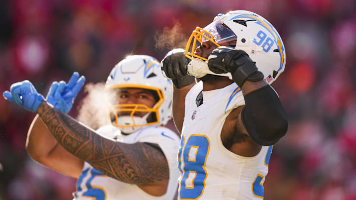 Dec 14, 2025; Kansas City, Missouri, USA; Los Angeles Chargers linebacker Odafe Oweh (98) celebrates a sack against the Kansas City Chiefs during the second half at GEHA Field at Arrowhead Stadium. Mandatory Credit: Jay Biggerstaff-Imagn Images