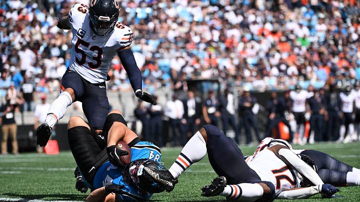 Sep 13, 2026; Charlotte, North Carolina, USA; Carolina Panthers tight end Mitchell Evans (84) catches the ball while defended by Chicago Bears linebacker T.J. Edwards (53) and linebacker Devin Bush (12) in the third quarter at Bank of America Stadium. Mandatory Credit: Bob Donnan-Imagn Images Sep 13, 2026; Charlotte, North Carolina, USA; Carolina Panthers tight end Mitchell Evans (84) catches the ball while defended by Chicago Bears linebacker T.J. Edwards (53) and linebacker Devin Bush (12) in the third quarter at Bank of America Stadium. Mandatory Credit: Bob Donnan-Imagn Images
