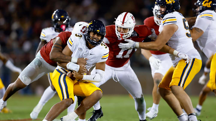 Cal quarterback Jaron-Keawe Sagapolutele is sacked by Stanford 