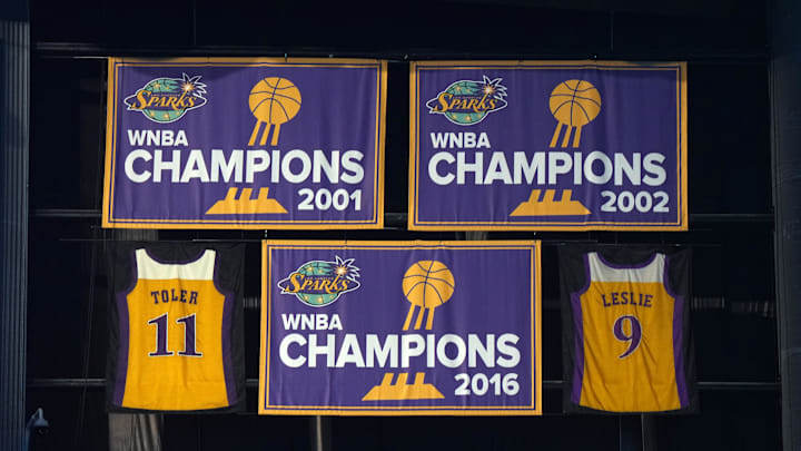 Jul 7, 2024; Los Angeles, California, USA; The LA Sparks 2001, 2002 and 2016 WNBA Championship banners and retired jerseys of Penny Toler (9) and Lisa Leslie (11) at Crypto.com Arena. Mandatory Credit: Kirby Lee-Imagn Images