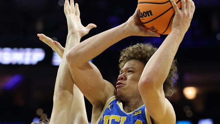 Mar 22, 2026; Philadelphia, PA, USA; UCLA Bruins guard Trent Perry (0) shoots the ball on UConn Huskies guard Braylon Mullins (24) in the second half during a second round game of the men's 2026 NCAA Tournament at Xfinity Mobile Arena. Mandatory Credit: Bill Streicher-Imagn Images Mar 22, 2026; Philadelphia, PA, USA; UCLA Bruins guard Trent Perry (0) shoots the ball on UConn Huskies guard Braylon Mullins (24) in the second half during a second round game of the men's 2026 NCAA Tournament at Xfinity Mobile Arena. Mandatory Credit: Bill Streicher-Imagn Images