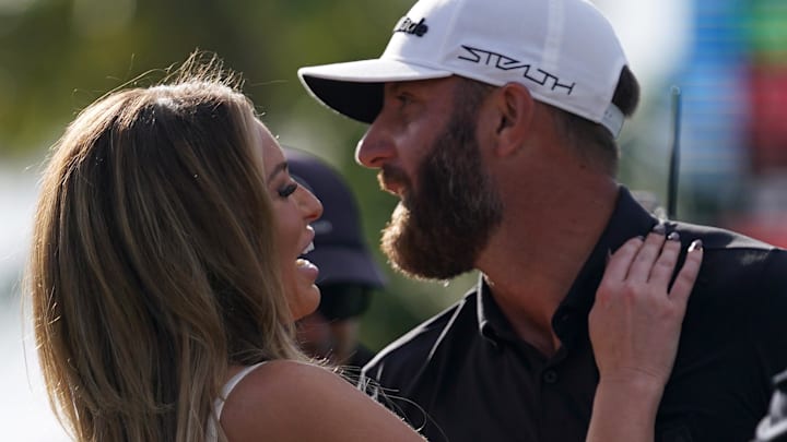 Aces GC captain Dustin Johnson embraces his wife Paulina Gretzky (L) after winning the team championship in the season finale of the LIV Golf series at Trump National Doral. Aces GC captain Dustin Johnson embraces his wife Paulina Gretzky (L) after winning the team championship in the season finale of the LIV Golf series at Trump National Doral.