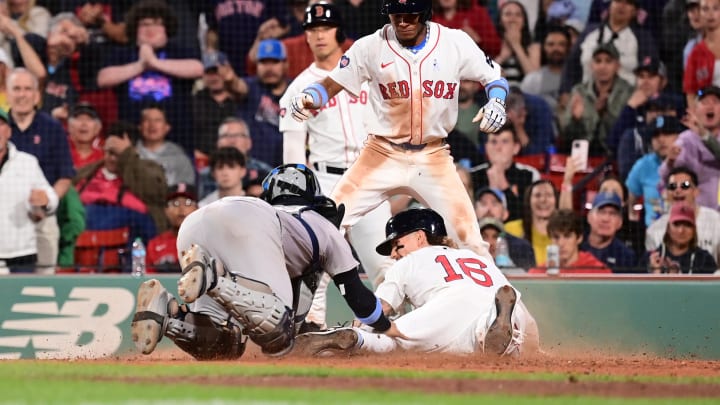 Jun 16, 2024; Boston, Massachusetts, USA; Boston Red Sox left fielder Jarren Duran (16) is tagged out by New York Yankees catcher Jose Trevino (39) during the eighth inning at Fenway Park. Mandatory Credit: Eric Canha-USA TODAY Sports