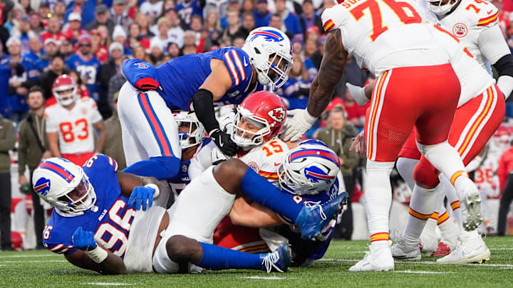 Nov 2, 2025; Orchard Park, New York, USA; Kansas City Chiefs quarterback Patrick Mahomes (15) is sacked by Buffalo Bills linebacker Terrel Bernard (8) and defensive end Joey Bosa (97) at Highmark Stadium.