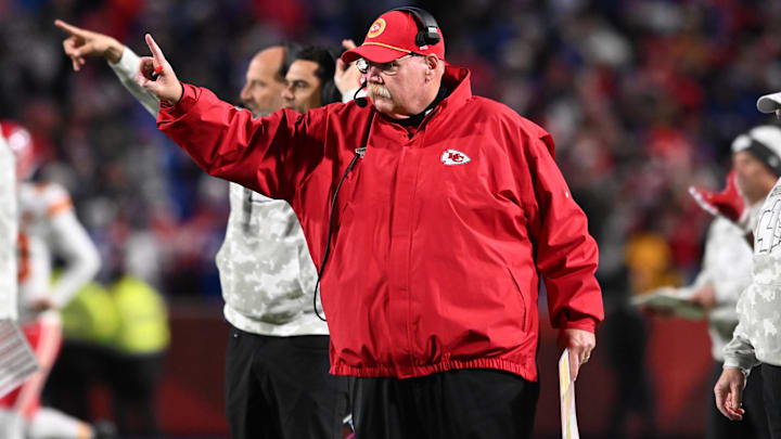 Kansas City Chiefs head coach Andy Reid signals to go for one point after a touchdown against the Buffalo Bills in the fourth quarter at Highmark Stadium.