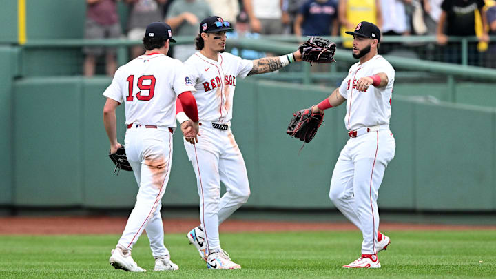 Jul 27, 2025; Boston, Massachusetts, USA; Boston Red Sox right fielder Roman Anthony (19) celebrates with left fielder Jarren Duran (16) and outfielder Wilyer Abreu (52) celebrate after a game against the Los Angeles Dodgers at Fenway Park. Mandatory Credit: Brian Fluharty-Imagn Images