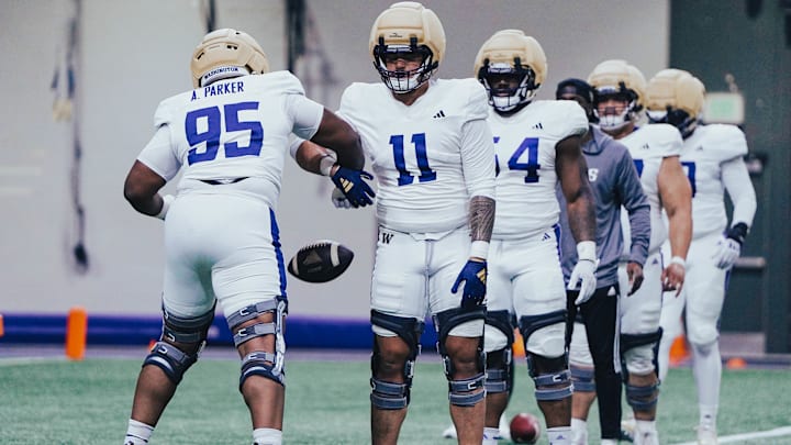 Ta'ita'i Uiagalelei (11) has a ball knocked from hands in a spring drill by Armon Parker. Ta'ita'i Uiagalelei (11) has a ball knocked from hands in a spring drill by Armon Parker.