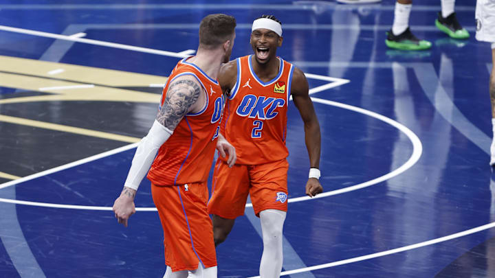 Dec 10, 2024; Oklahoma City, Oklahoma, USA; Oklahoma City Thunder guard Shai Gilgeous-Alexander (2) celebrates with center Isaiah Hartenstein (55) after he dunks against the Dallas Mavericks during the third quarter at Paycom Center. Mandatory Credit: Alonzo Adams-Imagn Images