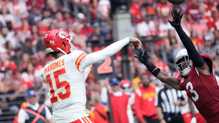 Kansas City Chiefs quarterback Patrick Mahomes (15) throws a pass while pressured by Arizona Cardinals safety Budda Baker (3) during the second quarter at State Farm Stadium in Glendale on Sept. 11, 2022. Kansas City Chiefs quarterback Patrick Mahomes (15) throws a pass while pressured by Arizona Cardinals safety Budda Baker (3) during the second quarter at State Farm Stadium in Glendale on Sept. 11, 2022.
