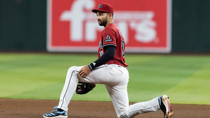 May 28, 2025; Phoenix, Arizona, USA; Arizona Diamondbacks second baseman Jordan Lawlar reacts after make a throwing error in the sixth inning against the Pittsburgh Pirates at Chase Field. Mandatory Credit: Mark J. Rebilas-Imagn Images