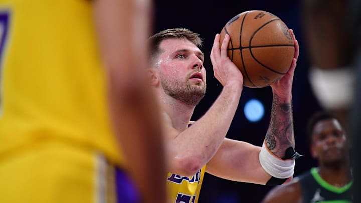 Apr 30, 2025; Los Angeles, California, USA; Los Angeles Lakers guard Luka Doncic (77) shoots a free throw against the Minnesota Timberwolves during the first half in game five of first round for the 2025 NBA Playoffs at Crypto.com Arena. Mandatory Credit: Gary A. Vasquez-Imagn Images