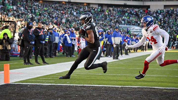 Jan 5, 2025; Philadelphia, Pennsylvania, USA; Philadelphia Eagles tight end E.J. Jenkins (84) catches 7-yard touchdown pass against New York Giants safety Dane Belton (24) during the fourth quarter at Lincoln Financial Field. Mandatory Credit: Eric Hartline-Imagn Images
