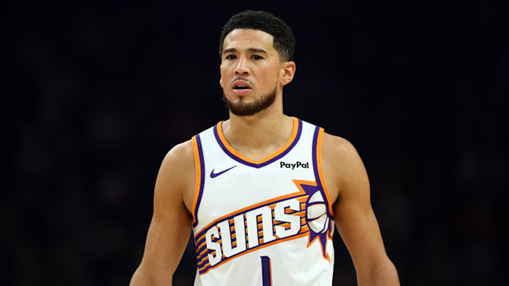 Nov 24, 2025; Phoenix, Arizona, USA; Phoenix Suns guard Devin Booker (1) against the Houston Rockets in the first half at Mortgage Matchup Center. Mandatory Credit: Mark J. Rebilas-Imagn Images