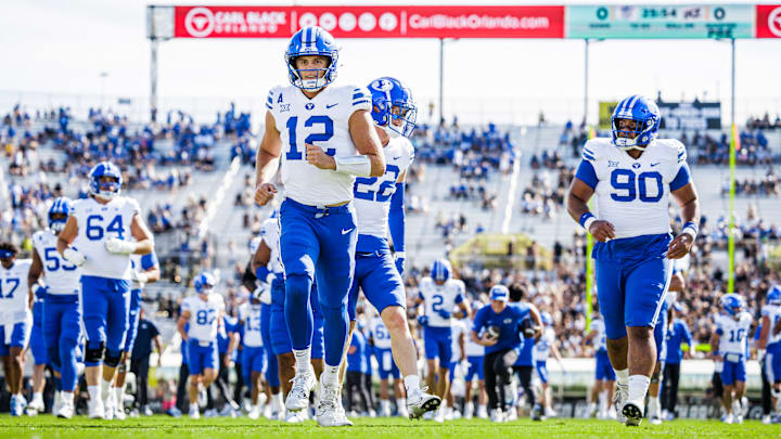 BYU quarterback Jake Retzlaff warms up before UCF game